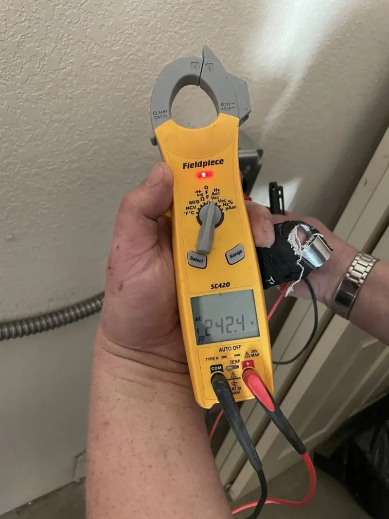 Voltage testing with clamp meter during Ceiling Fan Installation in Huntley